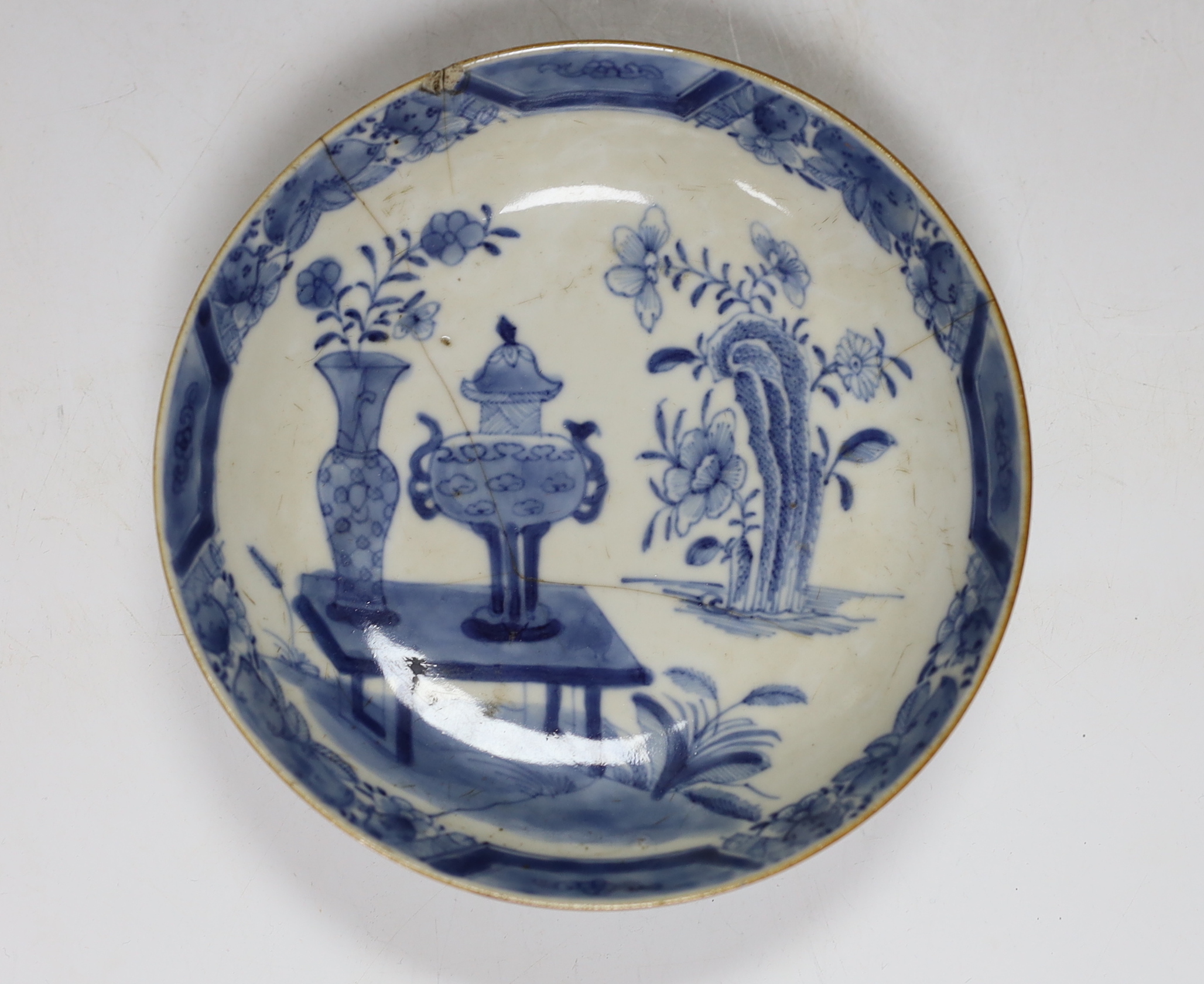 Two Chinese blue and white plates and a similar shallow bowl, largest 26cm high